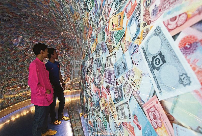 Fitchu00e2u20acu2122s rating upgrade sends positive signals to investors, with the Bursa and the ringgit strengthening on the news. u00e2u20acu201d Picture by Afiq Johari