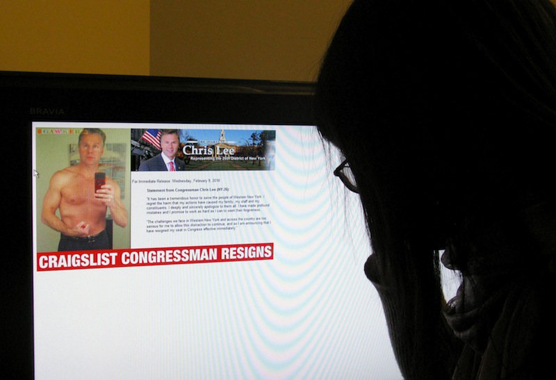A journalist looks looks at the Gawker.com internet site on February 10, 2011 in Washington, DC, showing a shirtless New York Republican Congressman Christopher Lee flexing in a mirror. u00e2u20acu201d AFP picnnn
