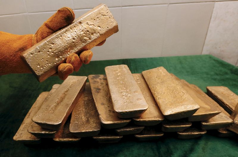 A melter places an ingot of 92.96 per cent pure gold at a procession plant of the Olimpiada gold operation, Eastern Siberia, Russia, June 30, 2015. u00e2u20acu201d Reuters pic