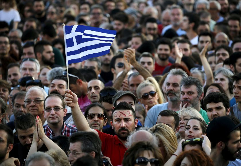 A protester sports the word 'No' in Greek on his forehead as he waves a Greek flag during an anti-austerity demonstration in Syntagma Square in Athens, Greece July 4, 2015. u00e2u20acu201d Reuters pic