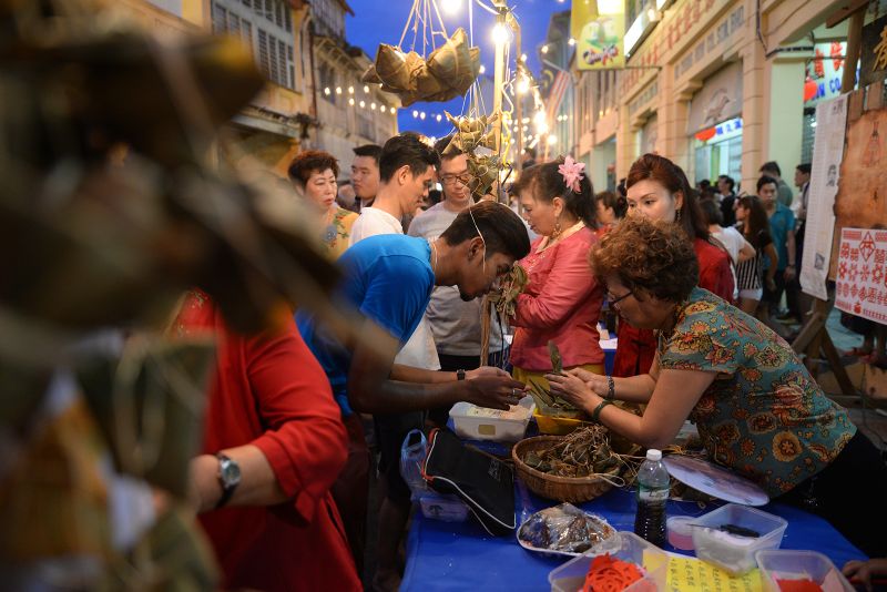 A workshop on how to wrap u00e2u20acu02dcbak changu00e2u20acu2122, glutinous rice dumplings, at the heritage celebrations.u00e2u20acu2022 Picture by K. E. Ooi