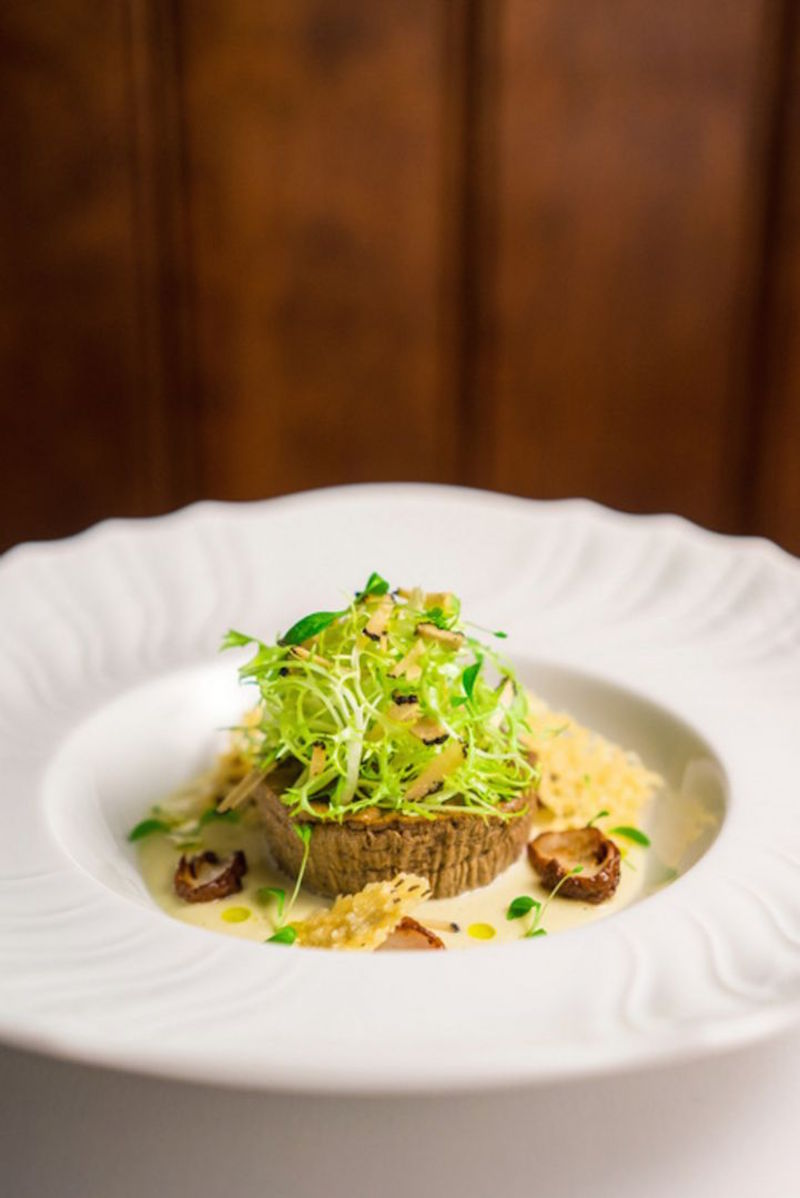 An elevated porcini mushroom flan with truffle leek veloute is just what diners at Osteria Art can expect. — TODAY pic