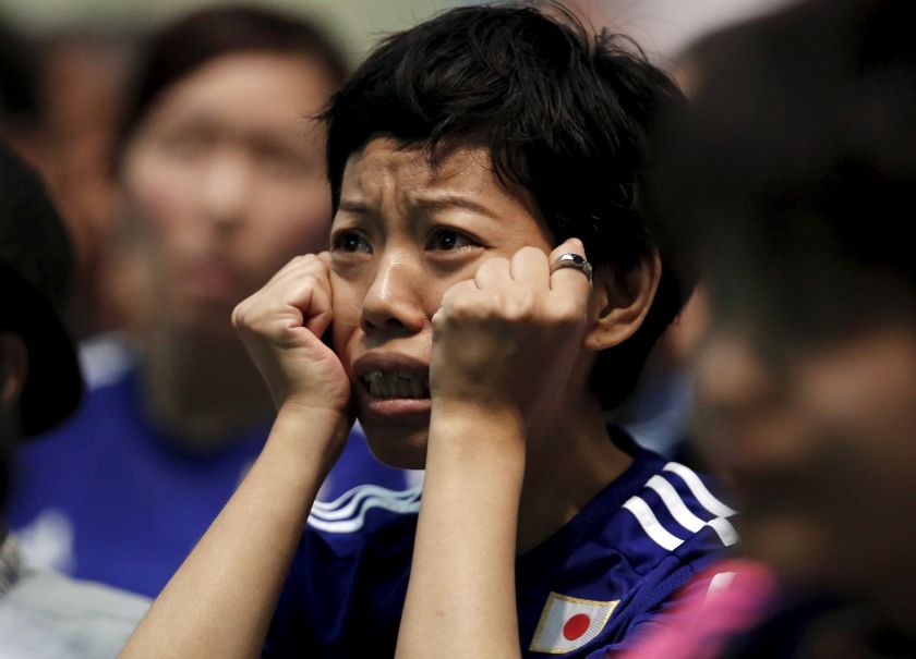 A Japan football fan reacts as she watches their Women's World Cup final against the US in Vancouver, at a public viewing event in Tokyo, Japan. u00e2u20acu201d Reuters pic