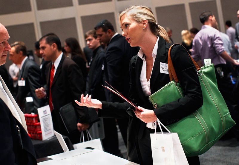 Paige Leonard speaks with a recruiter from a jewelry and gem company during the Gemological Institute Of America's Jewelry Career Fair in New York in this file photo from July 30, 2012. u00e2u20acu201d Reuters pic