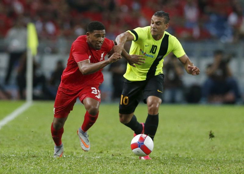 Liverpool's Jordon Ibe (left) fights for the ball with Malaysia's Charles Souza Chad during their friendly soccer match in Kuala Lumpur, Malaysia, July 24, 2015. u00e2u20acu2022 Reuters pic