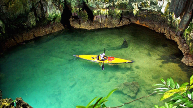 A kayaker explores a lagoon in a cavern. — TODAY pic