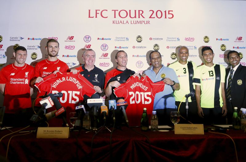 Liverpool players and staff pose with Malaysia XI players for a picture at a news conference in Kuala Lumpur. Picture releasaed July 23, 2015. u00e2u20acu2022 Reuters pic