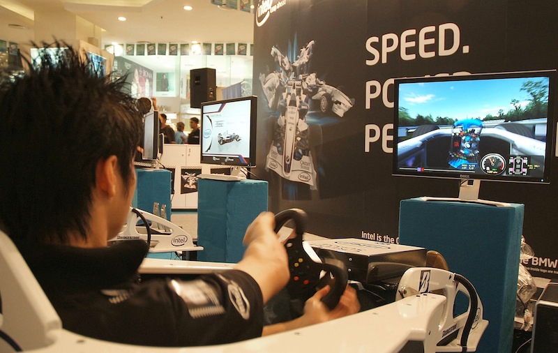 A man plays Formula One's race game at Plaza Low Yat in Kuala Lumpur, 04 April 2007. u00e2u20acu201d AFP pic