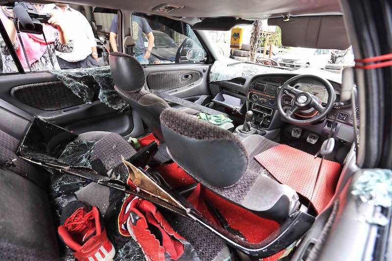 The Low Yat riot victimu00e2u20acu2122s car was badly damaged, July 15, 2015. u00e2u20acu2022 Picture by Saw Siow Feng