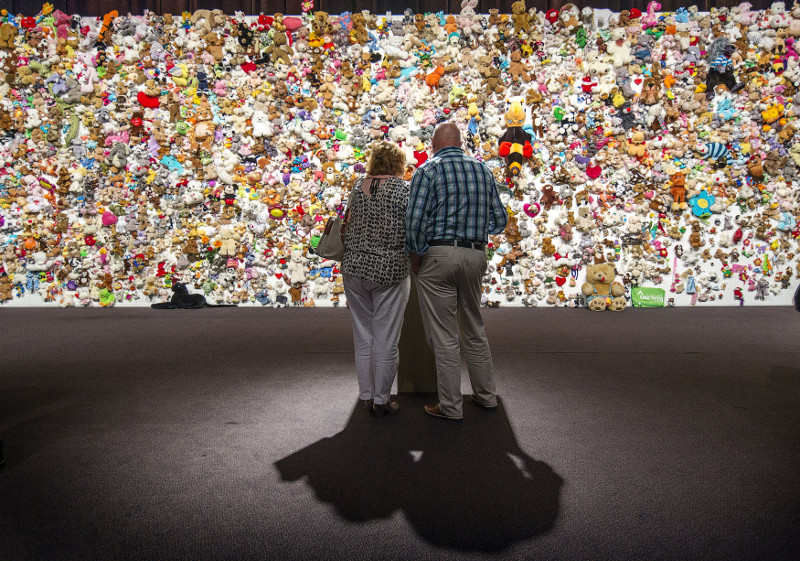 Family members and friends of victims gather in front of a 'hedge of compassion', made of thousands of soft toys, during a commemoration ceremony for the victims of Malaysia Airlines flight MH17 in Nieuwegein, July 17, 2015. u00e2u20acu201d Reuters pic