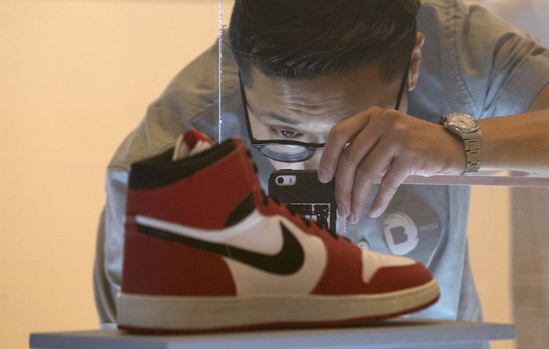 A visitor photographs an Air Jordan I during a preview for u00e2u20acu02dcThe Rise of the Sneaker Cultureu00e2u20acu2122 exhibit at the Brooklyn Museum in the Brooklyn borough of New York, July 9, 2015. u00e2u20acu201d Reuters pic