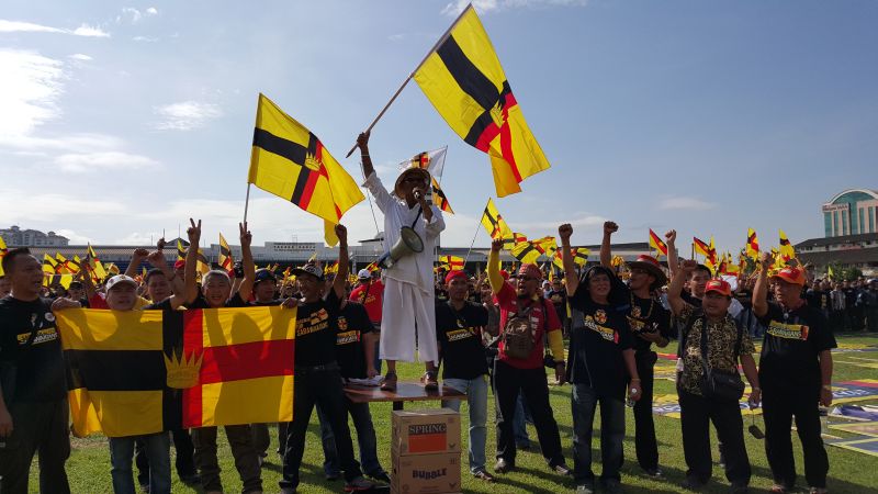 Peter John Jaban (standing on a table) in one of the scenes at the Sarawak For Sarawak Freedom and Independence Walk rally on July 22, 2015. u00e2u20acu2022 Picture by Sulok Tawie