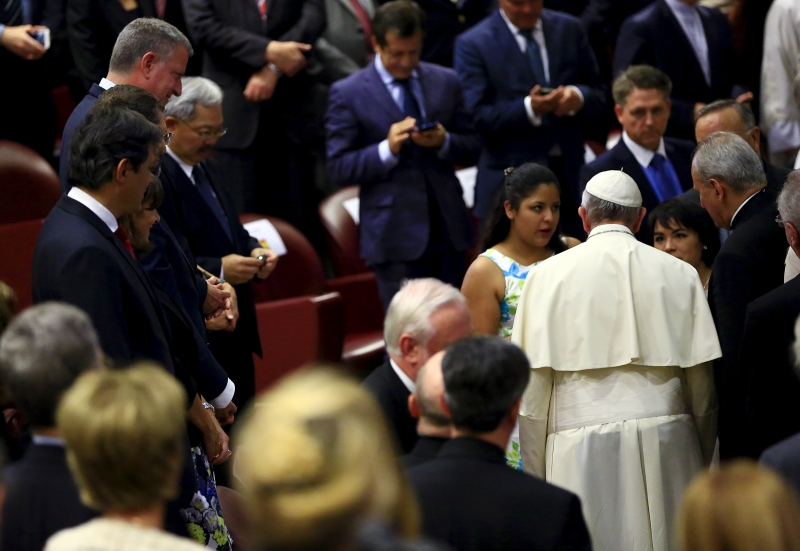 Pope Francis talks with victims of forced labour as New York City Mayor Bill de Blasio (top left) watches during the u00e2u20acu0153Modern Slavery and Climate Changeu00e2u20acu009d conference at the Vatican July 21, 2015. u00e2u20acu201d Reuters pic