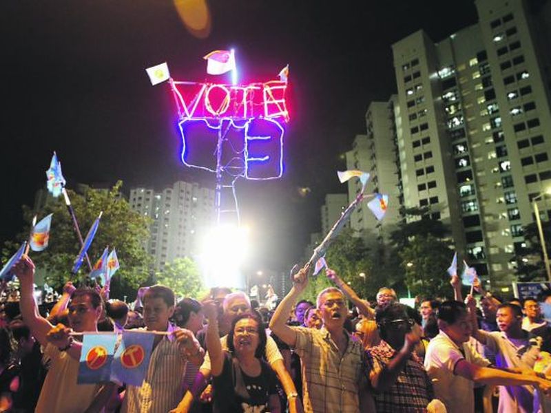 Supporters of the Workers' Party after the final rally for the Punggol East by-election in 2013. u00e2u20acu2022 Today pic