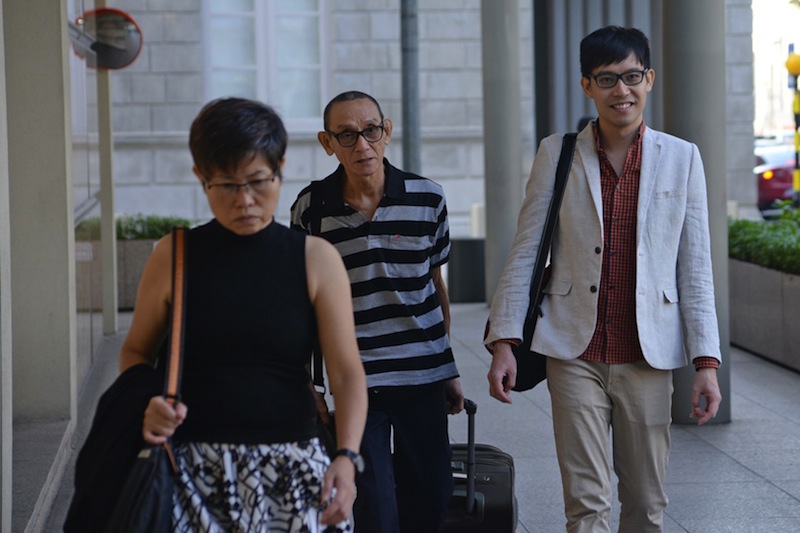 Roy Ngerng (right) walking into the Supreme Court, on July 3, 2015. u00e2u20acu201d TODAY pic