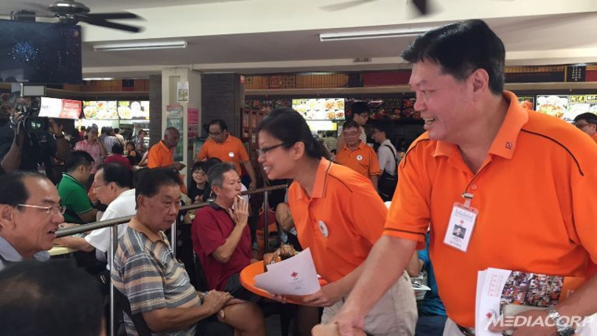 National Solidarity Party president Sebastian Teo (right) and acting general-secretary Hazel Poa meet residents at Tampines Street 81 on July 26, 2015. u00e2u20acu201d TODAY pic