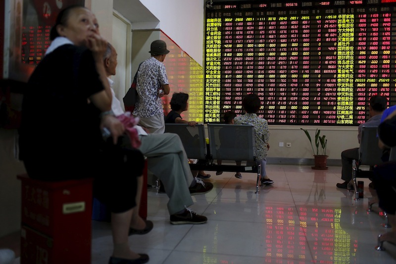 Investors look at an electronic board showing stock information at a brokerage house in Shanghai, China, July 13, 2015. u00e2u20acu201d Reuters pic