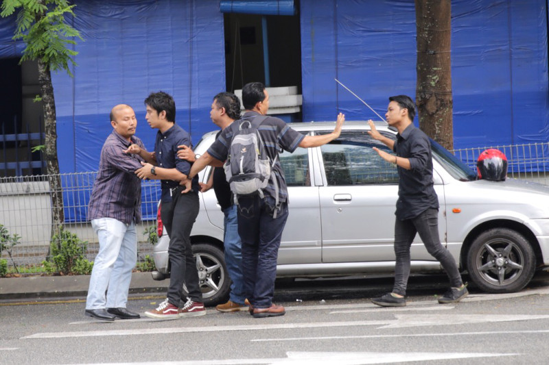 The police arresting student activists Adam Adli outside the Dang Wangi police headquarters, and both Adam and fellow activist Syukri Rezab are taken to Petaling police station, July 31, 2015. u00e2u20acu201d Picture by Choo Choy May