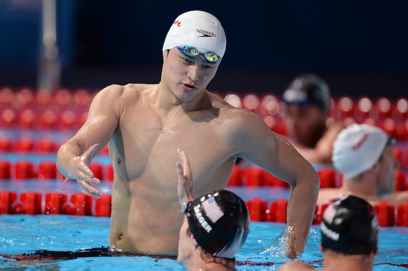 China's Sun Yang (top) celebrates with US swimmer Connor Jaeger after winning the final of the men's 800-metre freestyle swimming event in the FINA World Championships at Palau Sant Jordi in Barcelona on July 31, 2013. u00e2u20acu201d AFP picnnn