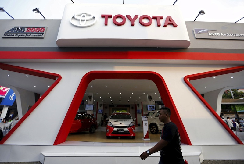 A man walks past the Toyota display at the Jakarta Fair car exhibition in Jakarta, Indonesia, June 30, 2015. u00e2u20acu201d Reuters pic