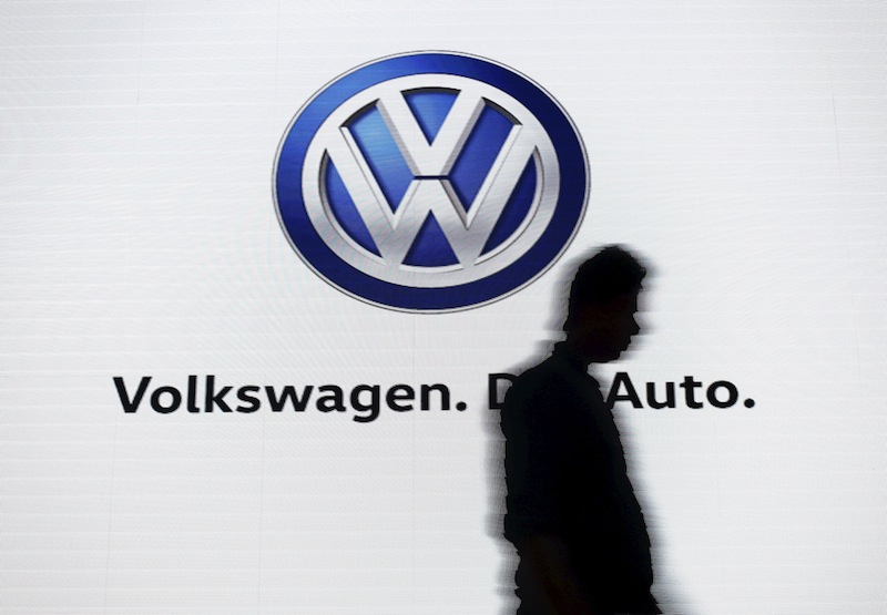 A man walks past a screen displaying a logo of Volkswagen at an event in New Delhi, India, June 23, 2015.u00c2u00a0u00e2u20acu201d Reuters pic