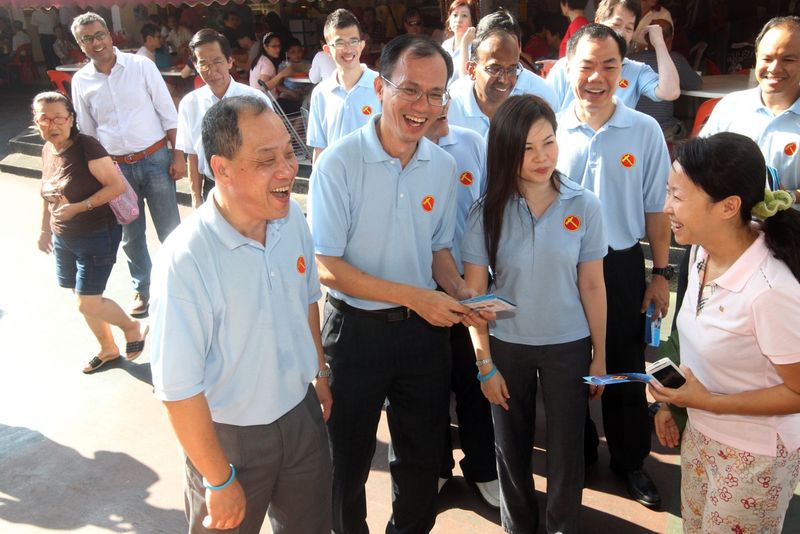Workers' Party's (front row, from left) Low Thia Khiang, Yee Jenn jong and Angela Oon in walkabout at Yishun ahead of the 2011 General Elections. u00e2u20acu201d TODAY pic
