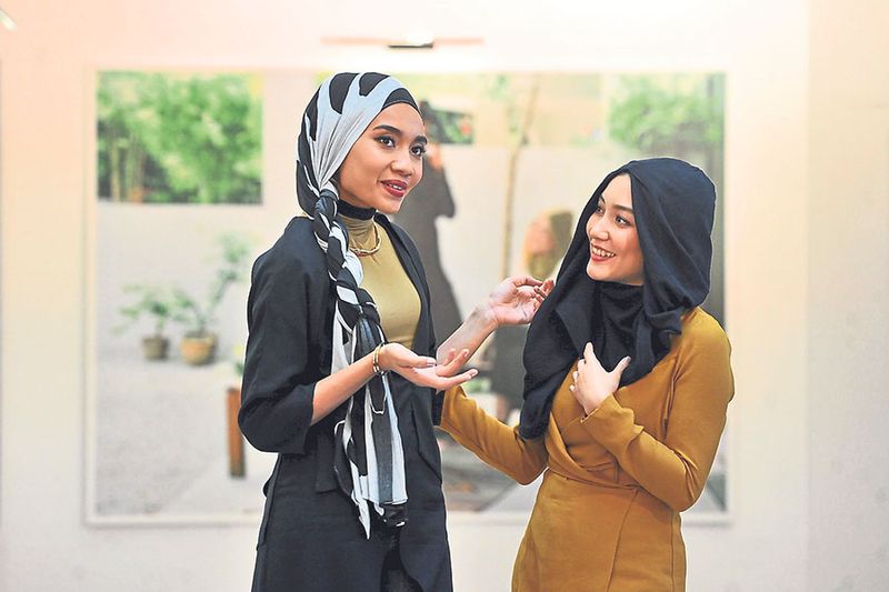 Yuna and Tajima spoke about fashion as a tool to change perceptions, attitudes and anxieties surrounding the hijab. u00e2u20acu201d Picture by Azinuddin Ghazali