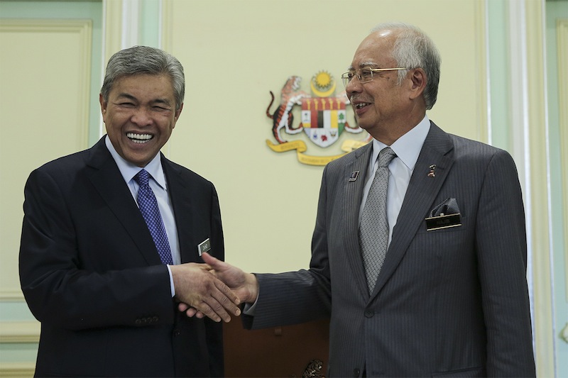 Prime Minister Datuk Seri Najib Razak shakes hand his new deputy Datuk Seri Zahid Hamidi at the Prime Minister Office in Putrajaya, July 28, 2015. u00e2u20acu201du00c2u00a0Picture by Yusof Mat Isa 