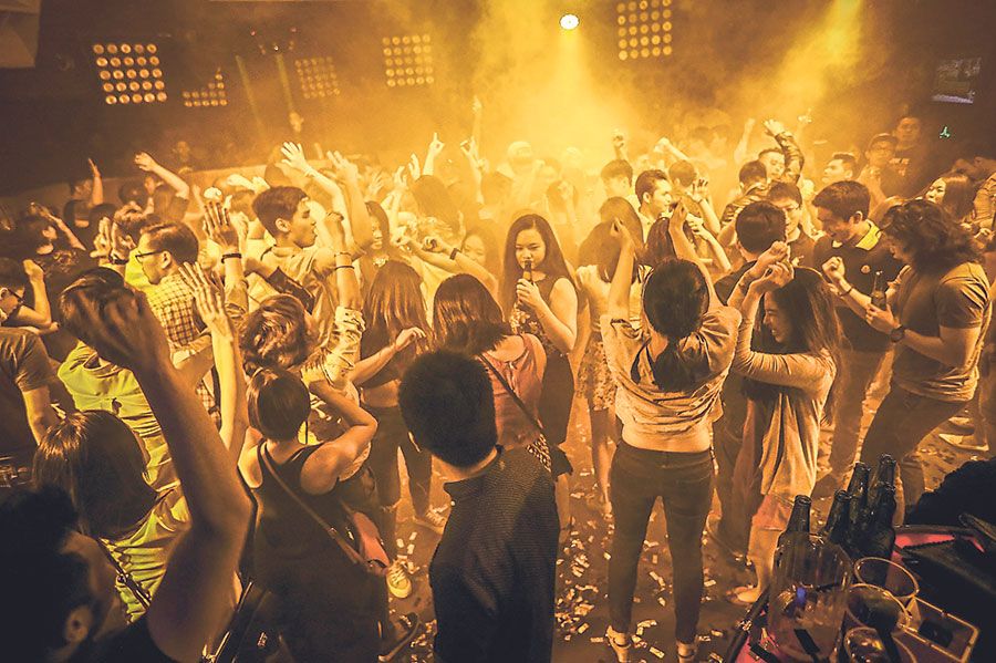 Revellers party for one last time at 'Light Out, Move Out.' — Picture by Firdaus Latiff