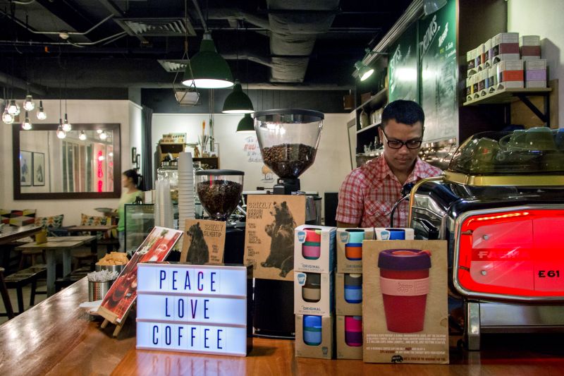 Barista JP making coffee for a customer on the go.