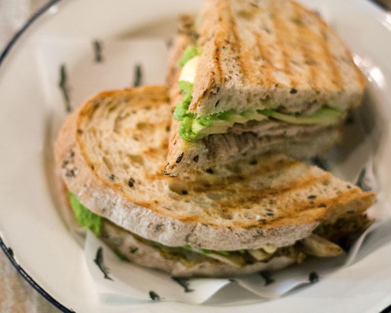 The delicious, made-to-order chicken avocado toastie with grilled cheese.