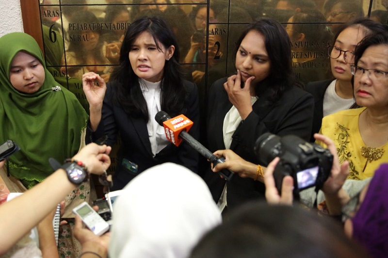 Michelle Yesudas (second from left) speaks to reporters at the Jalan Duta Court Complex in Kuala Lumpur, August 3, 2015. u00e2u20acu201d Picture by Choo Choy May