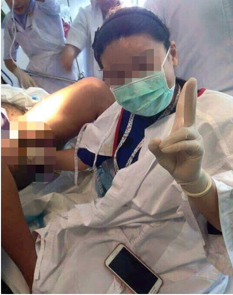 A screen capture of the post on Kerabu Bersuara Group's Facebook page showing the doctor striking a pose while attending to a patient in labour. 