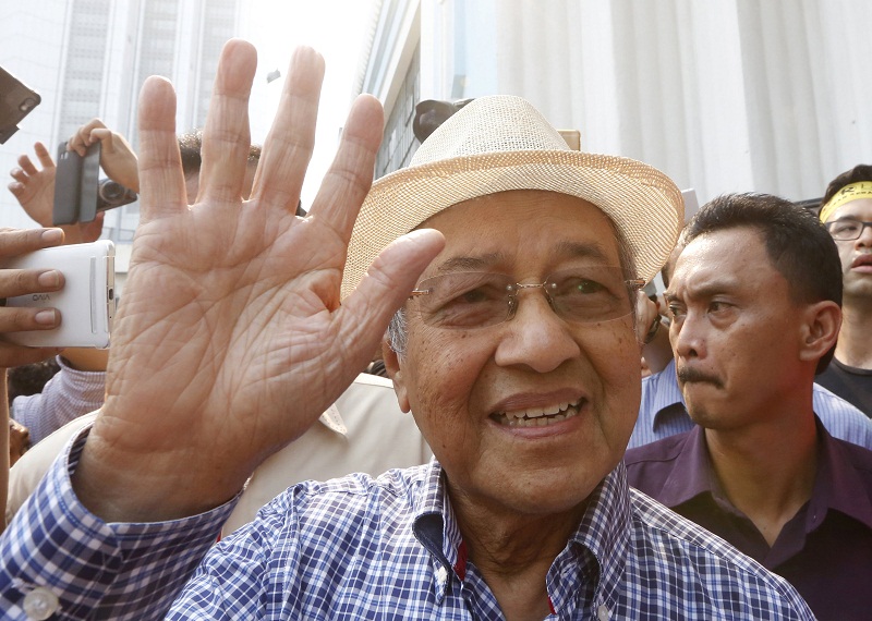 Former Prime Minister Tun Dr Mahathir Mohamad waves as he attends a rally organised by pro-democracy group Bersih near Central Market in  Kuala Lumpur, August 30, 2015. u00e2u20acu201d Reuters pic