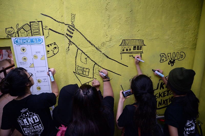 KL Sketch Nation and Band of Doodlers sketching Skippy's story at China House.