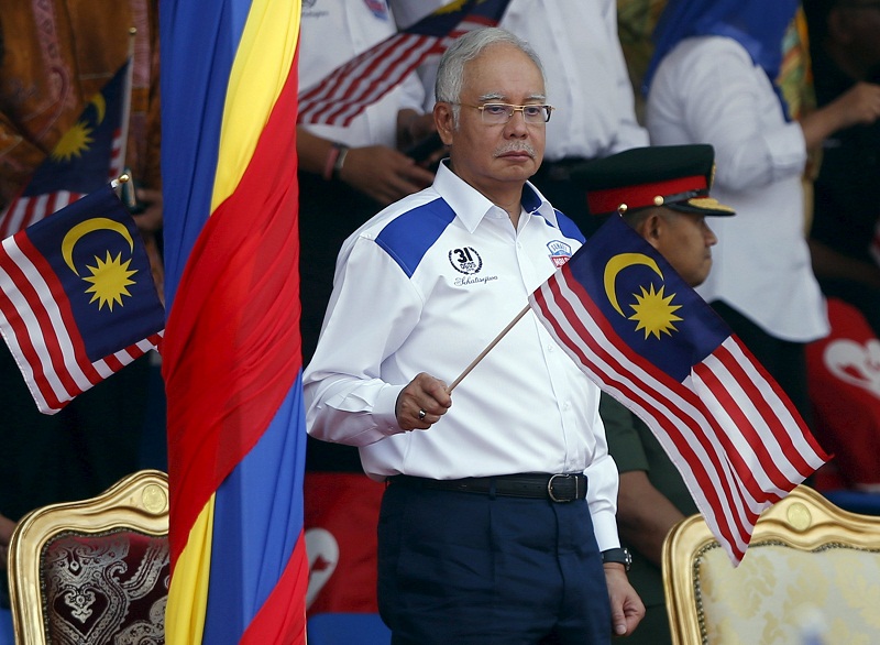 Prime Minister Datuk Seri Najib Razak waves the national flag during National Day celebrations in Kuala Lumpur, August 31, 2015. u00e2u20acu201d Reuters pic