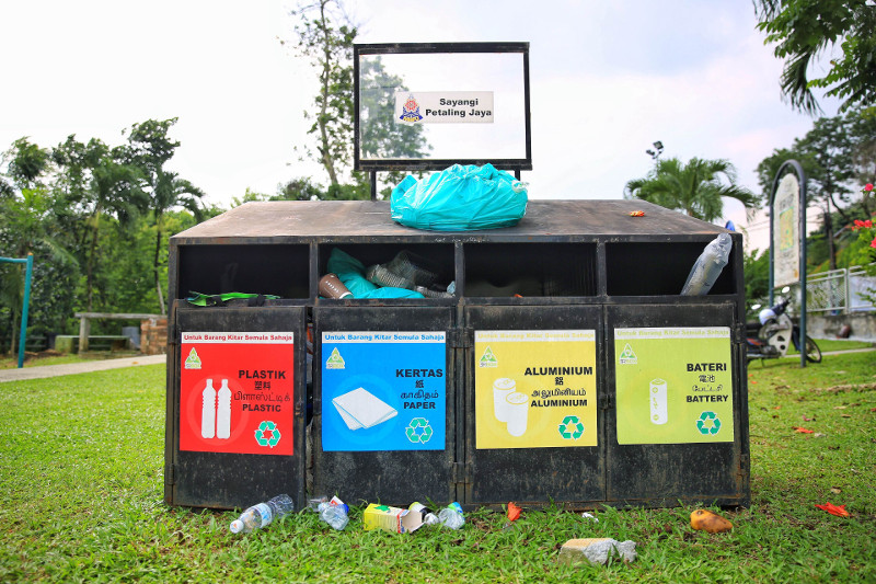 Recycling bins in Bukit Gasing, Petaling Jaya that has trash all over it. — Picture by Saw Siow Feng