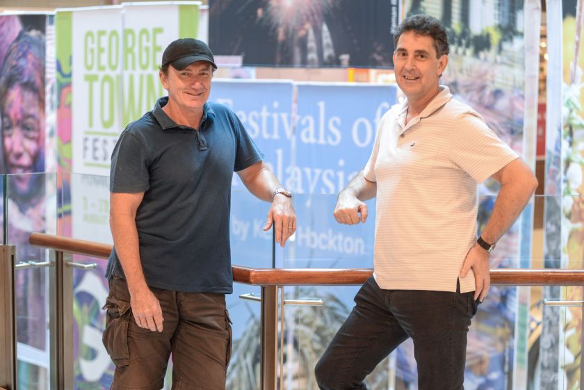 Keith Hockton (left) and Marcus Langdon at an exhibit showcasing excerpts from Hocktonu00e2u20acu2122s book u00e2u20acu02dcFestivals of Malaysiau00e2u20acu2122 at Gurney Plaza. u00e2u20acu2022 Picture by K.E.Ooi 