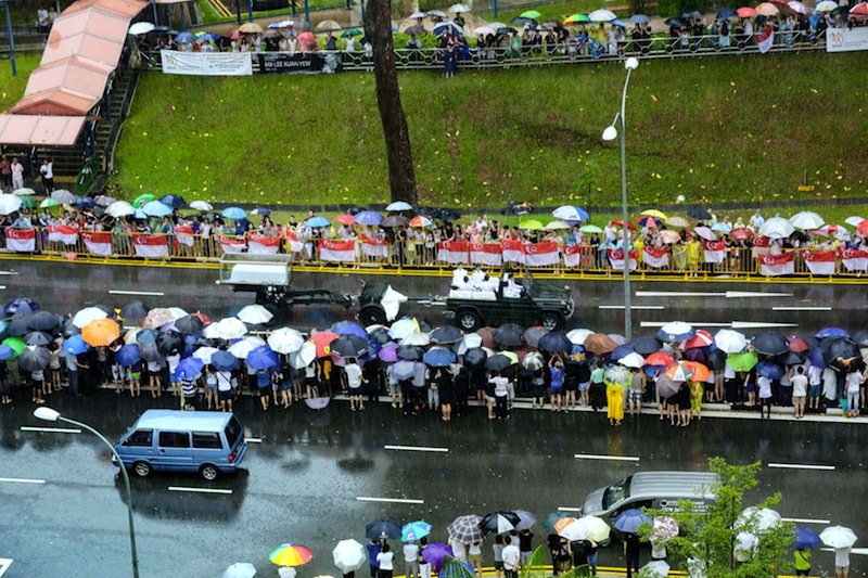 Crowds stood in the rain to give the late Mr Lee Kuan Yew a final send-off as the gun carriage made its way to the University Cultural Centre for the state funeral service on March 29, 2015. u00e2u20acu201du00c2u00a0TODAY pic