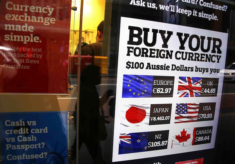 A pedestrian is reflected in the window of a foreign currency exchange store, which is displaying a board with Australian dollar currency values, in central Sydney, Australia, August 12, 2015.u00c2u00a0u00e2u20acu201du00c2u00a0Reuters pic
