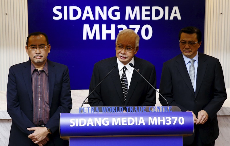 Najib (centre) with Datuk Seri Liow Tiong Lai (right) confirms the debris found on Reunion Island is from missing Malaysia Airlines flight MH370 in Kuala Lumpur, Malaysia, August 6, 2015.u00c2u00a0u00e2u20acu201d Reuters pic