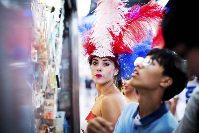 Paola Peña dressed in a head piece and body paint at Times Square in New York.