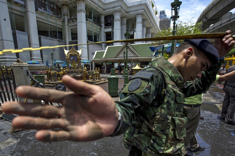 A member of military personnel stops the media from taking pictures at the Erawan shrine, the site of a deadly blast, in central Bangkok, Thailand, August 18, 2015.u00c2u00a0u00e2u20acu201d Reuters pic