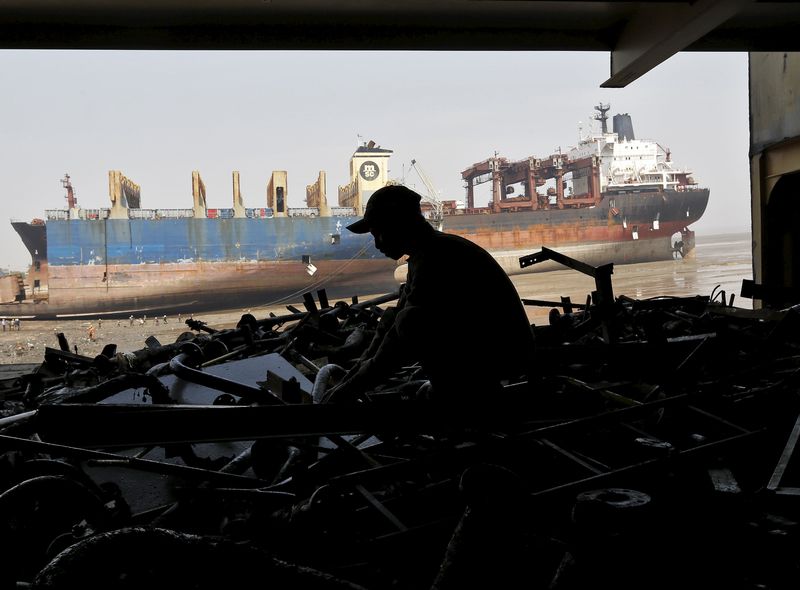 A worker sorts out the engine parts of a decommissioned ship at the Alang shipyard in Gujarat, India, March 27, 2015. u00e2u20acu201d Reuters pic