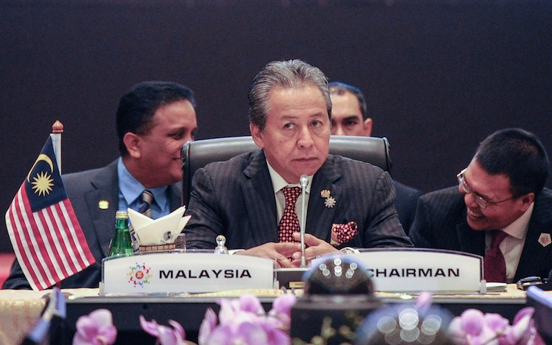 Malaysia's Foreign Minister Datuk Seri Anifah Aman (centre) takes his seat before the start of the 48th Association of Southeast Asian Nations Foreign Ministers Meeting at the Putra World Trade Centre in Kuala Lumpur on August 4, 2015. u00e2u20acu201d AFP picnnn