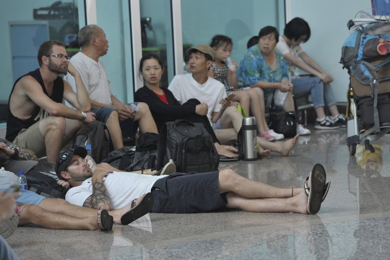 Passengers wait at the international departure terminal at Ngurah Rai Airport, on the resort island of Bali, July 22, 2015 in this photo taken by Antara Foto. u00e2u20acu201d Reuters pic