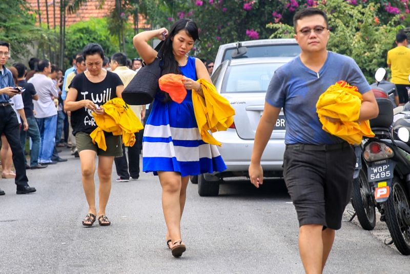 Supporters rush to buy the last batch of the popular yellow Bersih 4 T-shirts. u00e2u20acu2022 Picture by Saw Siow Feng
