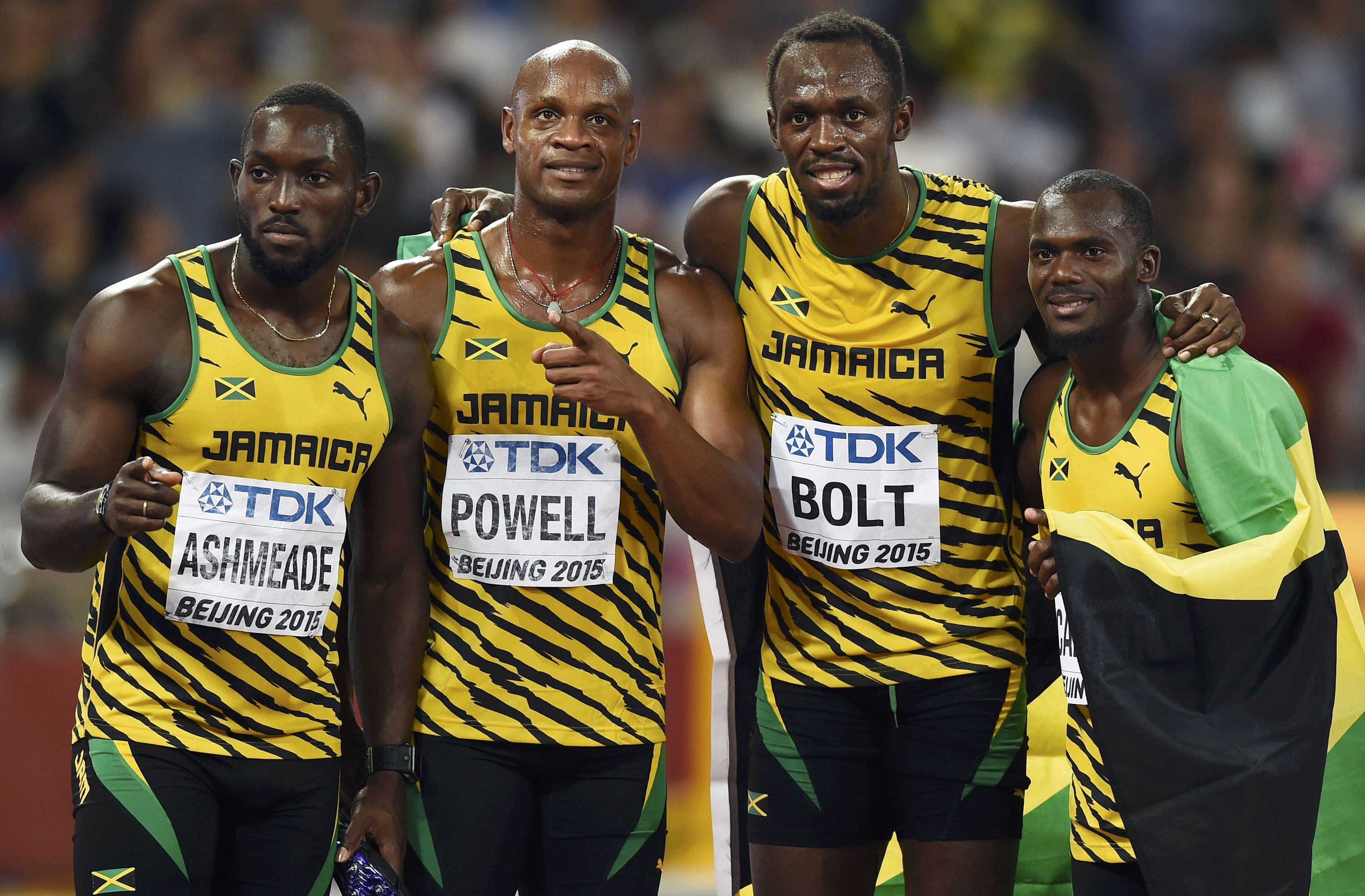 Jamaicau00e2u20acu2122s team (left to rigt) Nickel Ashmeade, Asafa Powell, Usain Bolt and Nesta Carter pose for photographers after winning the menu00e2u20acu2122s 4 x 100 metres relay final during the 15th IAAF World Championships at the National Stadium in Beijing, China, Augu