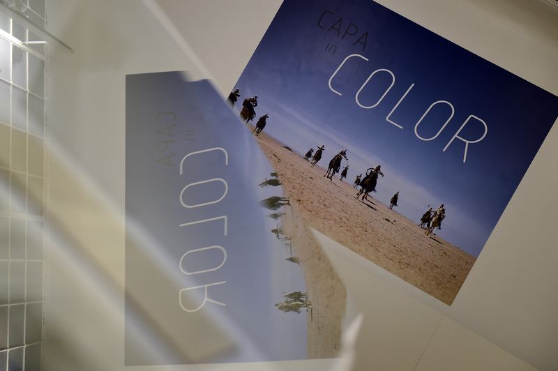 People visit the exhibition on July 2, 2015 as color photographs of the Hungarian born, French-American Robert Capa are presented by the Capa Centre of Budapest for the first time in Europe. u00e2u20acu201d AFP pic