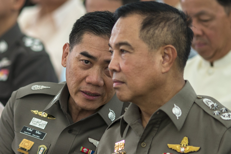 (From left) The next Thai national police chief Chakthip Chaijinda and incumbent Somyot Pumpanmuang during a religious ceremony near the Erawan shrine, the site of Monday's deadly blast, in central Bangkok, Thailand, August 21, 2015. u00e2u20acu201d Reuters pic